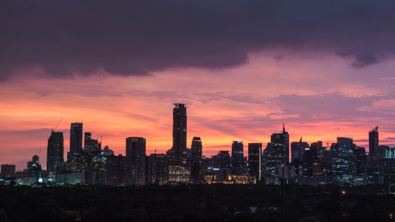 A skyline of Manila at sunset.