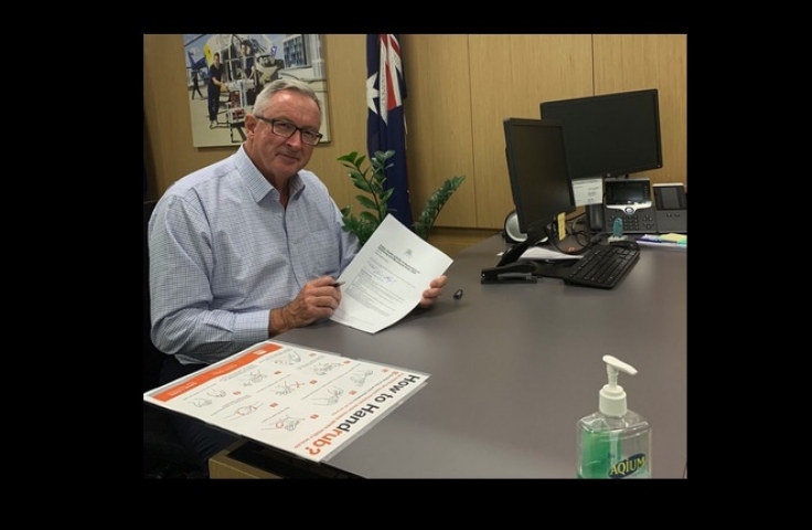 NSW Health Minister Brad Hazard signs the order on 30 March.