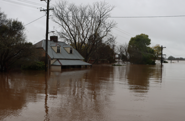 A rural Australian house is flooded up to its first storey